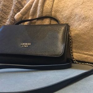 Black leather Guess purse. Never used